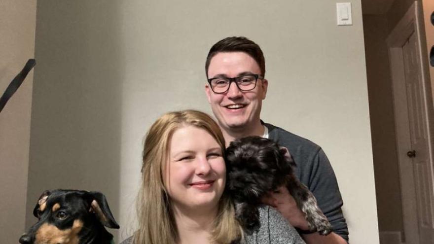 selfie of couple with a dog